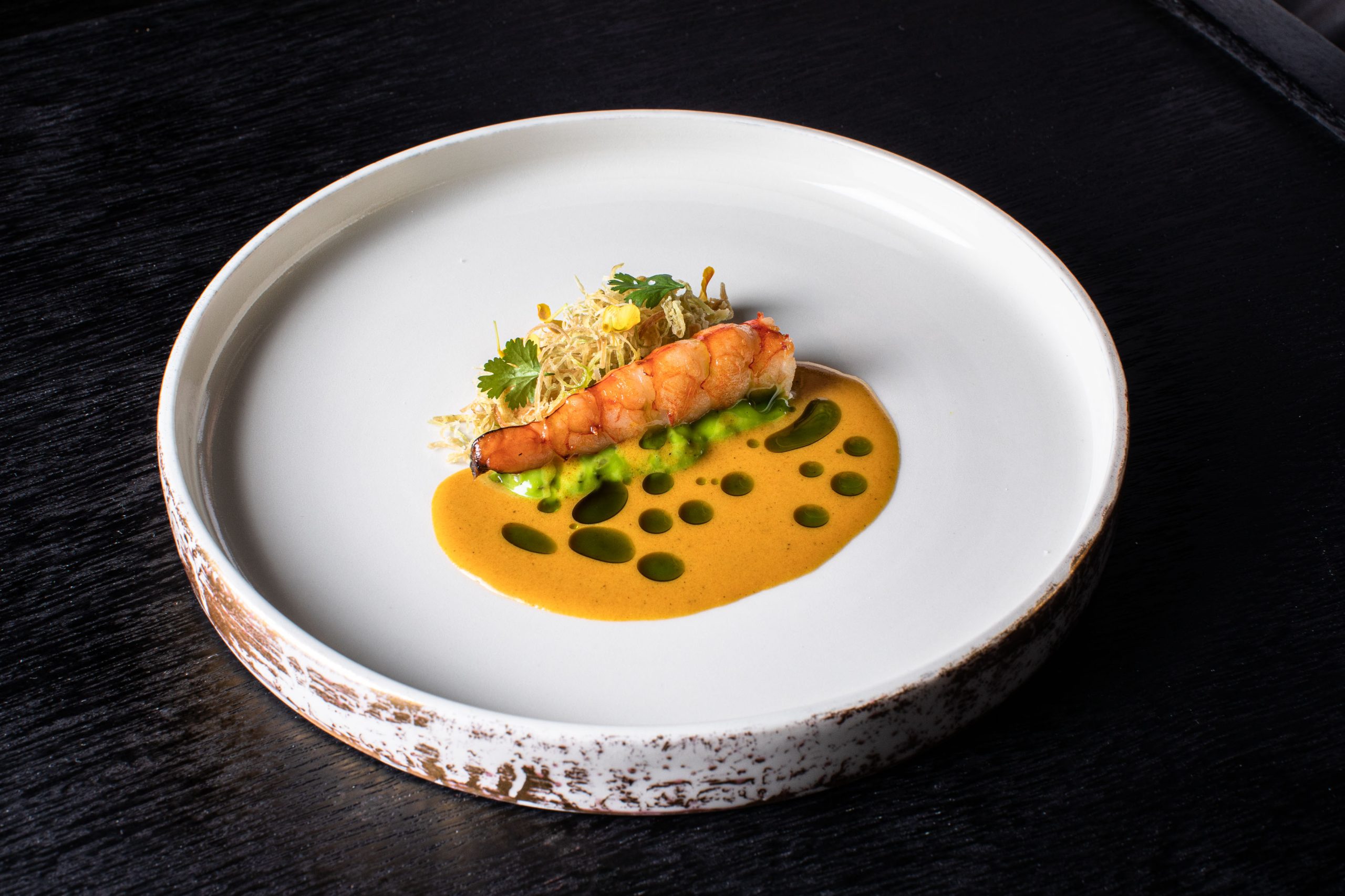 A michelin meal of red prawn elegantly plated